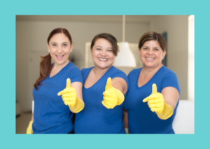 A row of three lady cleaners wearing blue uniforms and wearing yellow rubber cleaning gloves. Taken from recruiting cleaning staff - what paperwork do you need from the Maid In Business blog