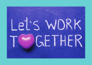 Turquoise background with a purple chalk board with the words let's work together written on it - maid in business blog 